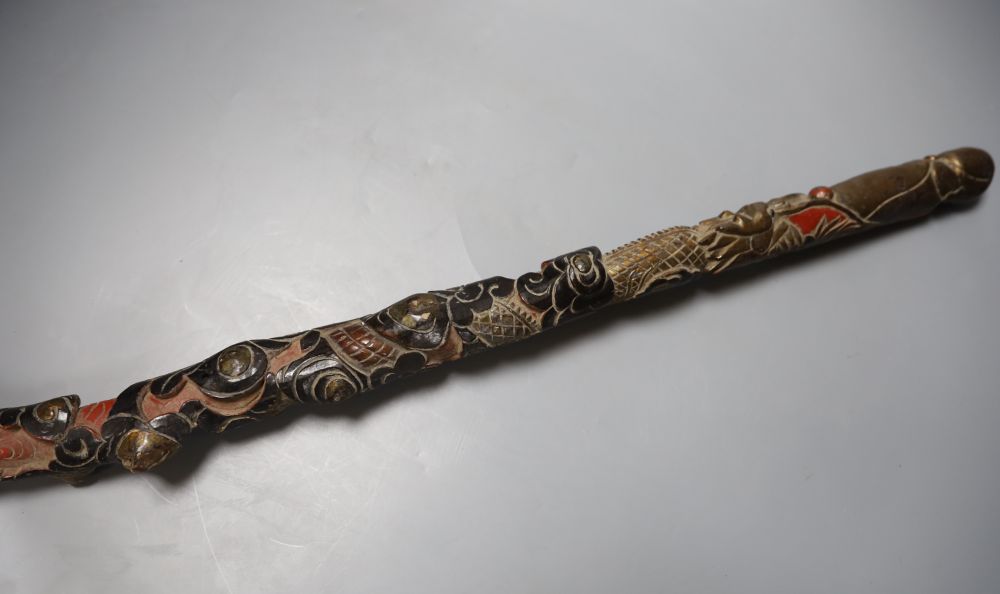 Three Chinese carved wood walking sticks, largest 108cm